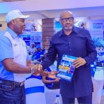 Secretary to the Delta State Government, Dr. Kingsley Emu (right), representing Governor Sheriff Oborevwori, receives a copy of the Delta State Signage and Advertising Agency (DESSAA) Digital Manual from the Agency's Managing Director, Hon. Sebastien Okoh, during the unveiling of DESSAA's digital platform in Asaba on Thursday.