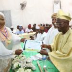 Sowunmi-Kolapo receiving the certificate of installation